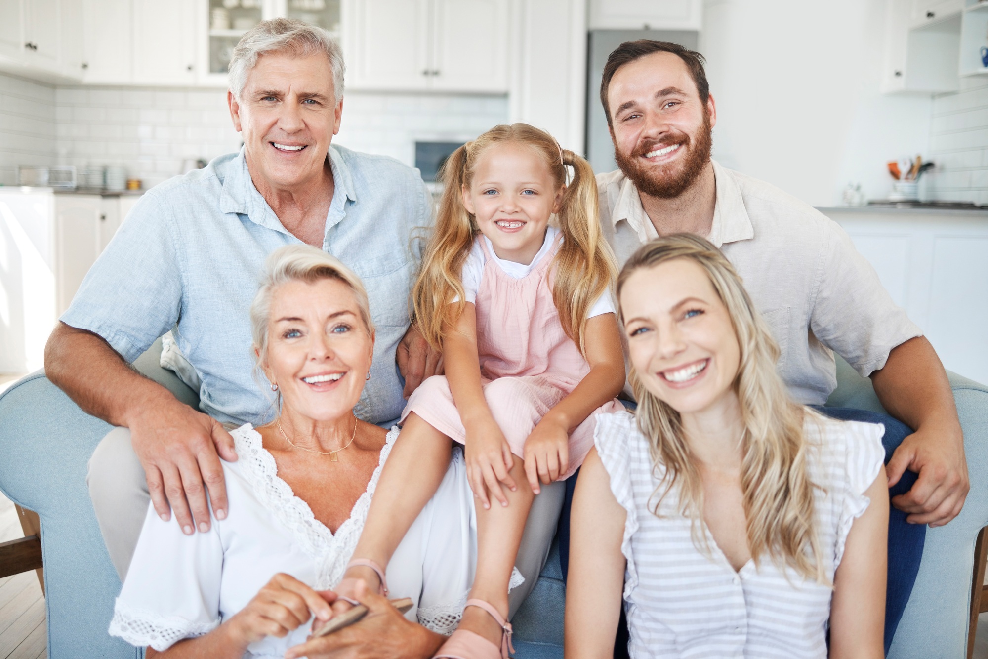 Family, happy and together, love and bonding in portrait in the family home. Grandparent, parent an